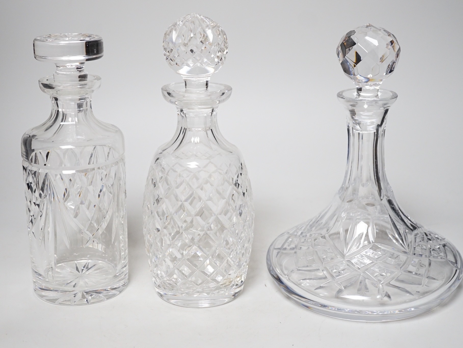 Two Waterford decanters and a lead crystal ship's decanter